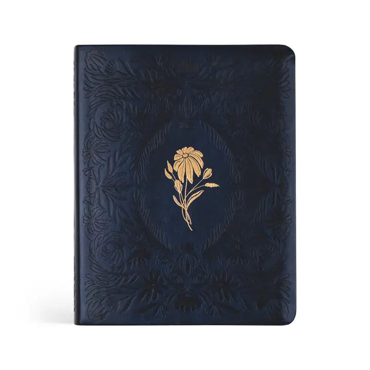 Dark blue embossed notebook with a gold floral design on a white background