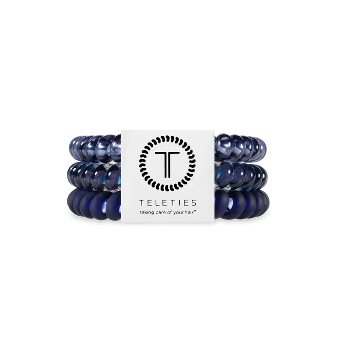 Set of blue hair ties with a Teleties label on a white background