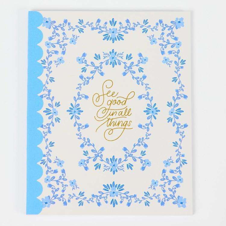 Decorative card with blue floral border and gold text on a white background