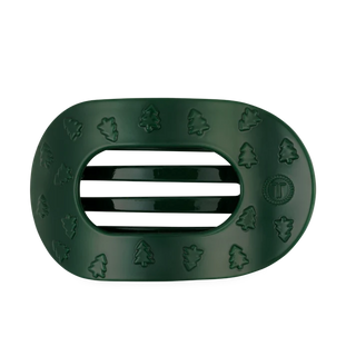 green oval shaped flat hair clip with raised christmas tree design