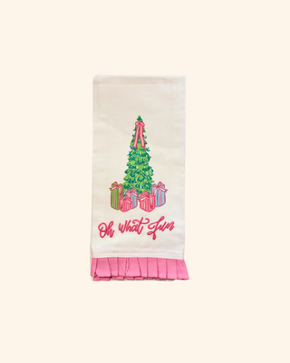 white towel Featuring a cheerful Christmas tree adorned in pink ribbons and surrounded by beautifully wrapped gifts and pink ruffle trim