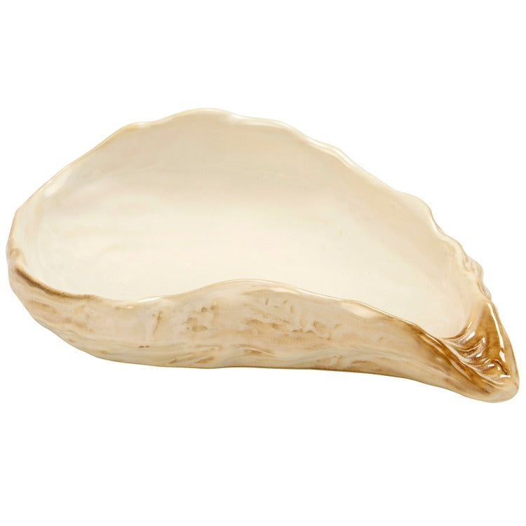 Beige ceramic dish with a unique shape on a white background