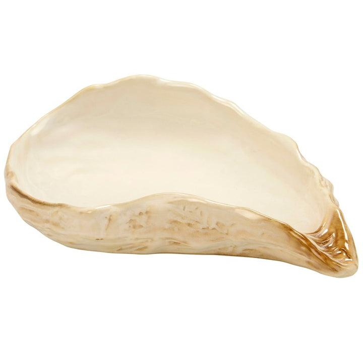 Beige ceramic dish with a unique shape on a white background