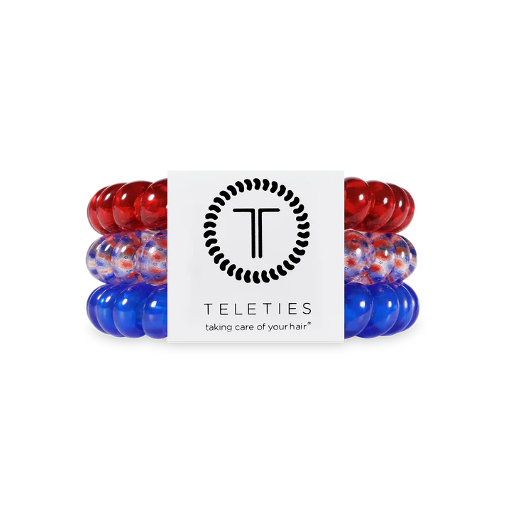 Red and blue hair ties with Teleties logo on a white background
