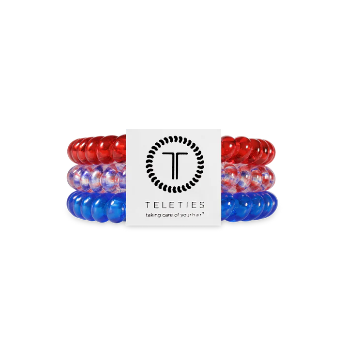 Set of red, white, and blue hair ties with Teleties logo in the center on a white background