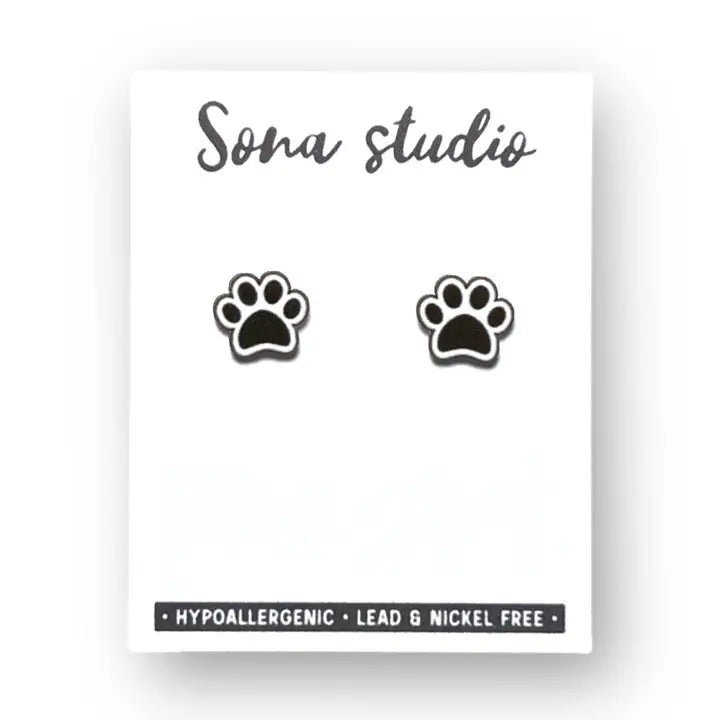 Paw print earrings on a white card with 'Sona Studio' branding.