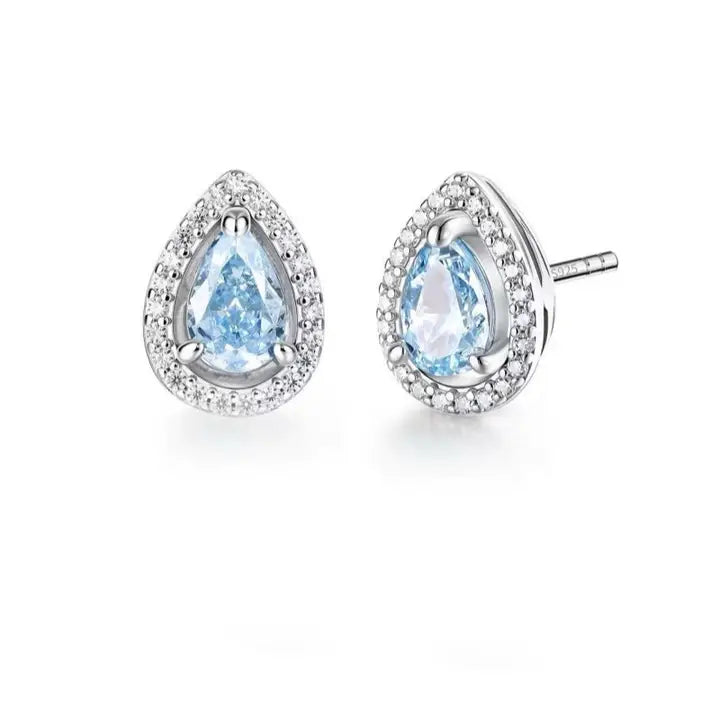 Pair of earrings with pear-shaped blue gemstones on a white background