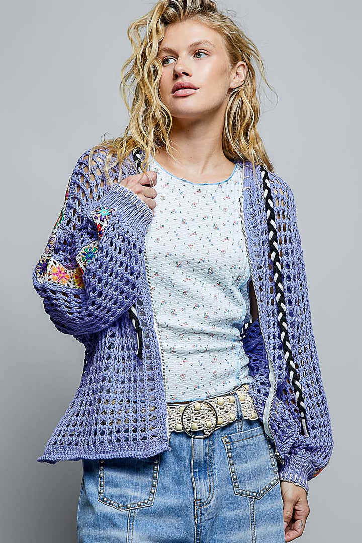 woman wearing bluish purple mesh knit zipper sweater with hood