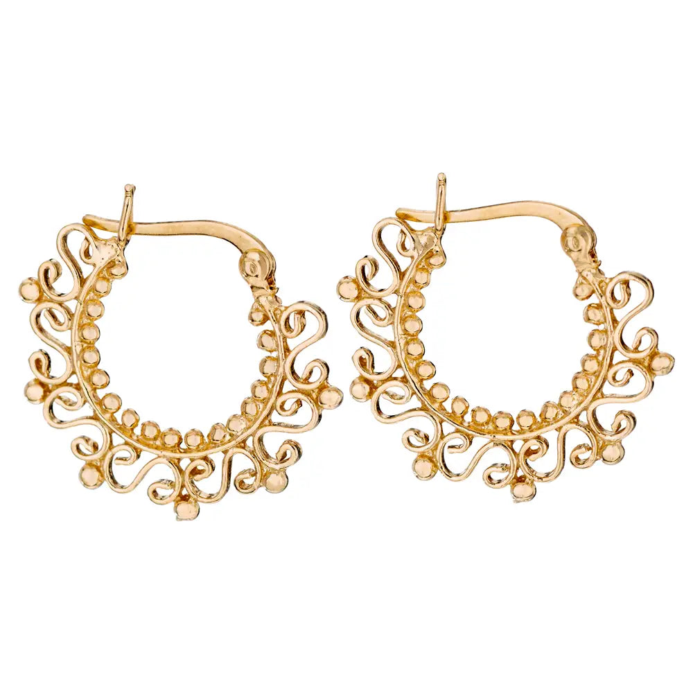 Gold hoop earrings with intricate designs on a white background