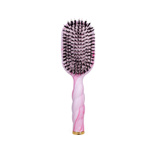 Hairbrush with pink handle and black bristles on a white background