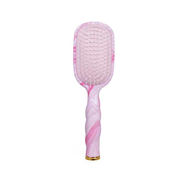 Pink and white paddle brush on a white background