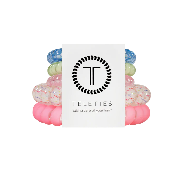 Set of colorful hair ties with a Teleties branded card on a white background