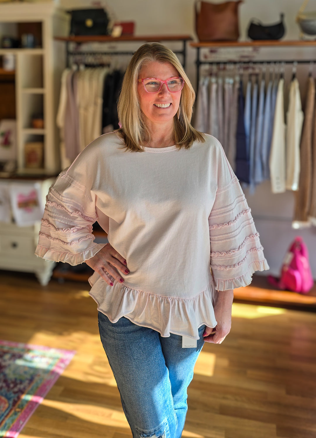 pink cotton top with 3/4 ruffle sleeves and ruffle hem