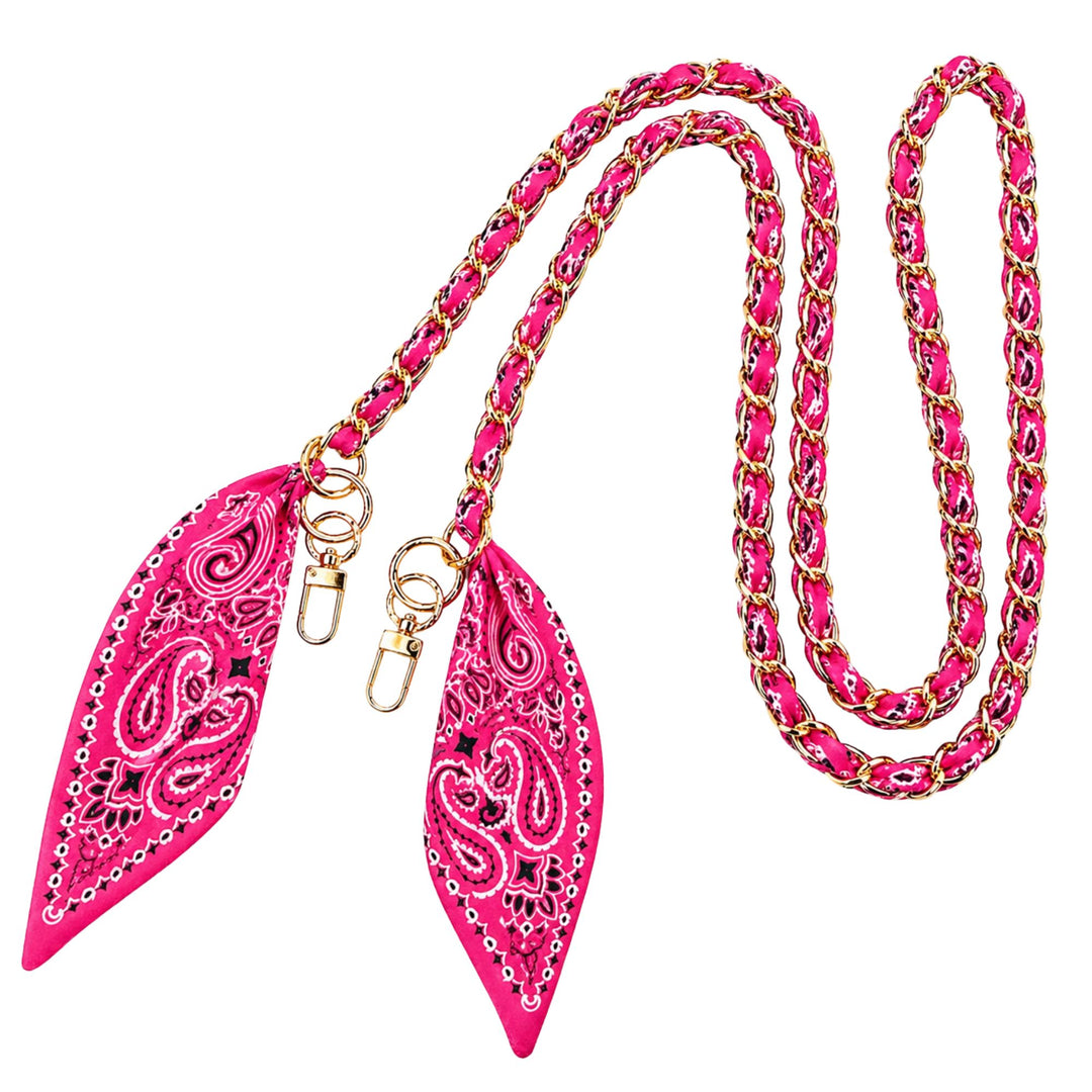A bright pink and gold chain leash with two matching pointed leather pulls featuring a paisley pattern, shown on a plain white background.