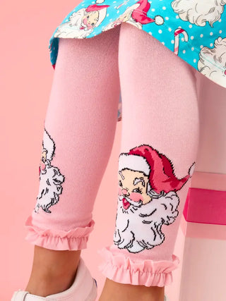 girl wearing pink tights with ruffle hem and cute santa face
