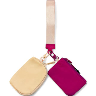 Two small pouches, one beige and one pink, with a strap on a white background.
