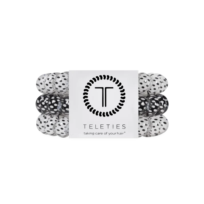pack of 3 coil hair ties, 2 white with black polka dots, and one black with white polka dots