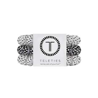 pack of 3 coil hair ties, 2 white with black polka dots, and one black with white polka dots