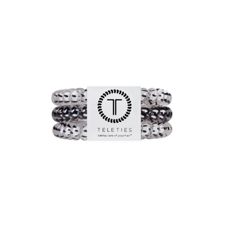 pack of 3 coil hair ties, 2 white with black polka dots, and one black with white polka dots