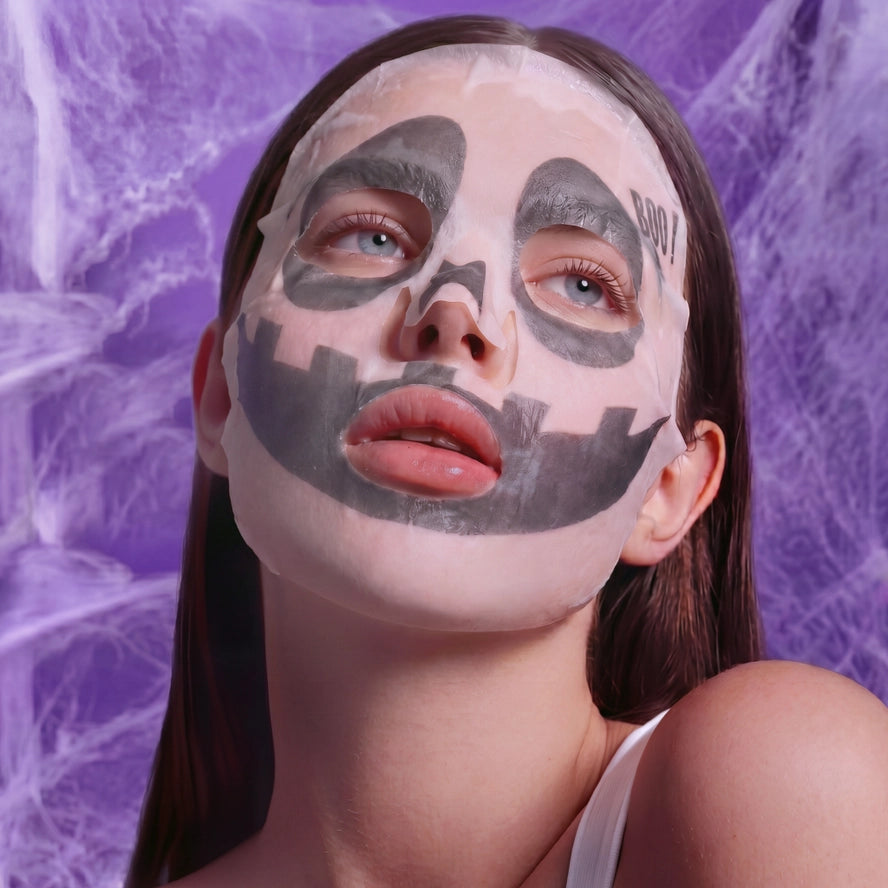 girl wearing white face mask with ghost print 