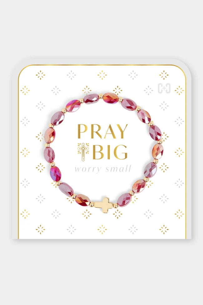 Beaded bracelet with red and gold beads and a gold cross charm
