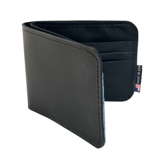 Black leather wallet with a visible brand label on a white background