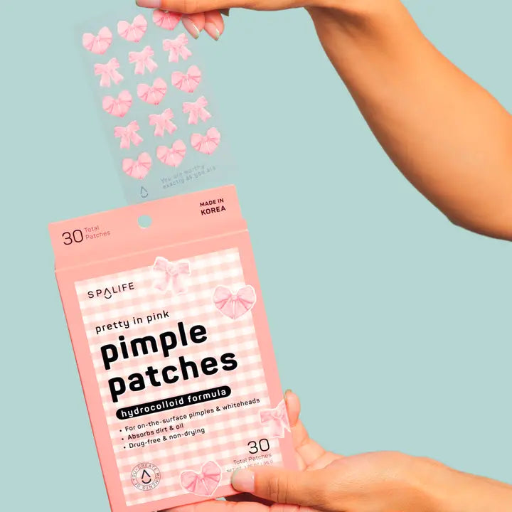 Spa Life pimple patches packaging with pink flowers on a light blue background