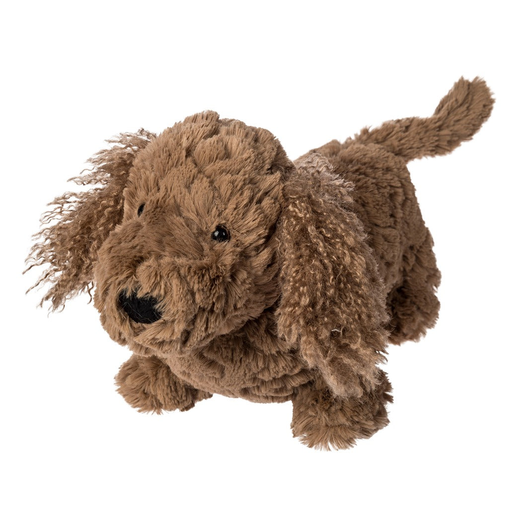 Brown plush dog toy on a white background