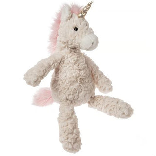 stuffed animal shaped like a unicorn with a gold horn and pink hair