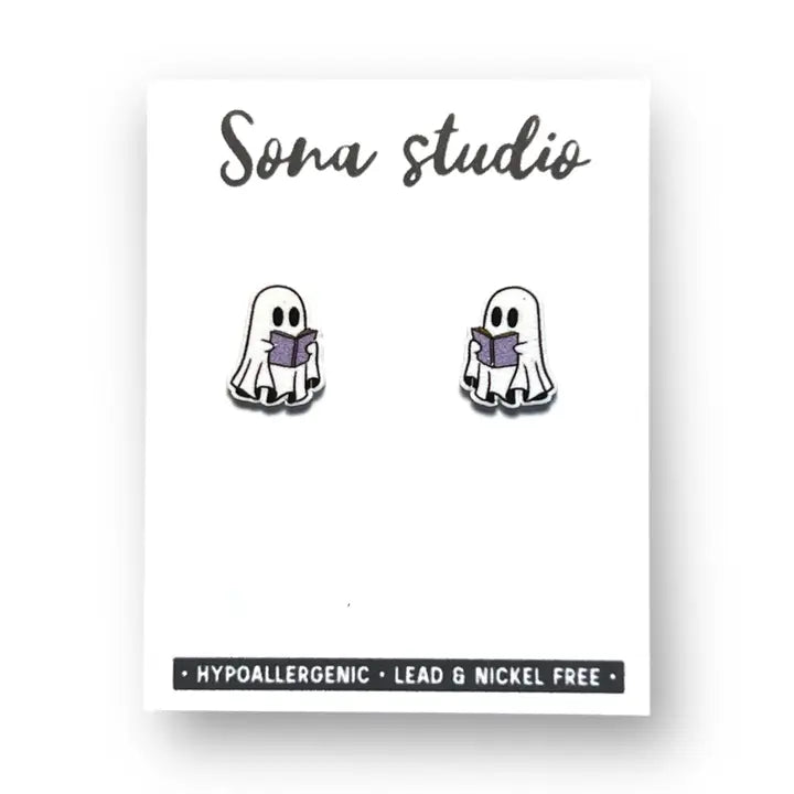 Ghost-shaped earrings with a book on a white card with 'Sona studio' branding.
