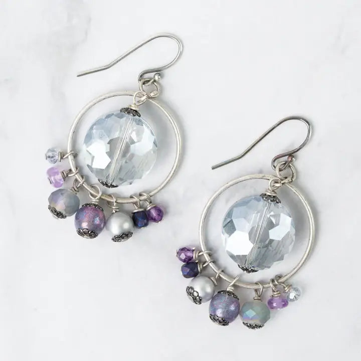 Earrings with clear glass beads and colorful beads on a white background