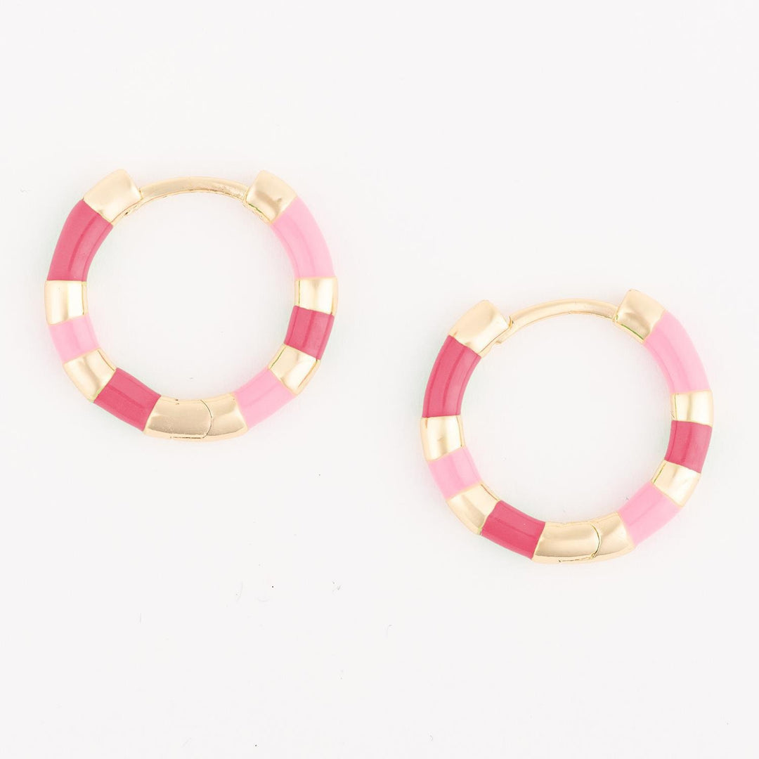 Pair of hoop earrings with pink and gold color scheme on a white background