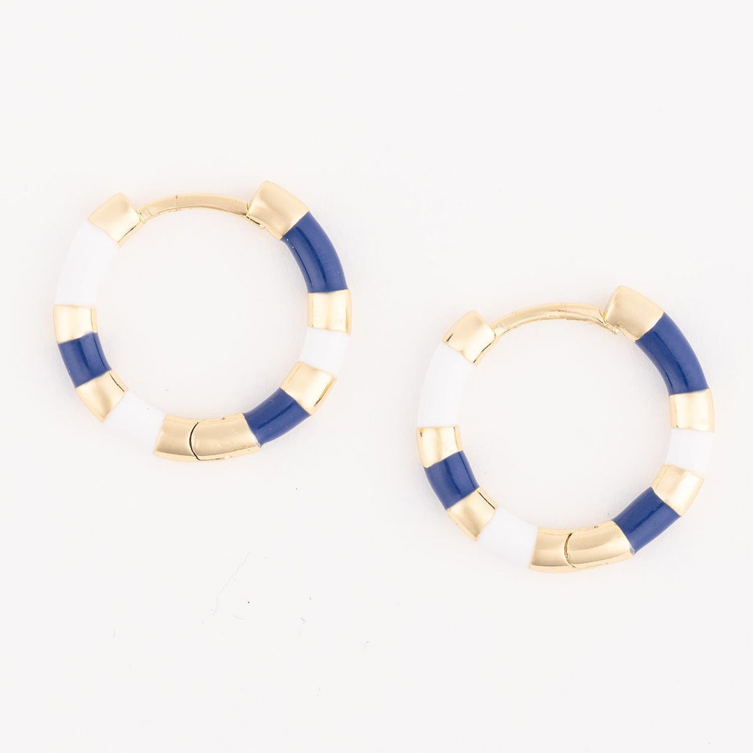 Pair of gold hoop earrings with blue accents on a white background