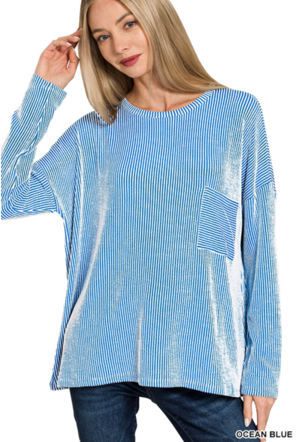 woman wearing long sleeve oversized blue and white striped top