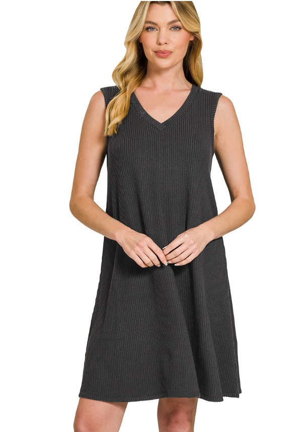 Woman wearing a black sleeveless dress on a white background