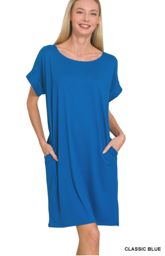 woman wearing a blue short sleeve dress with pockets