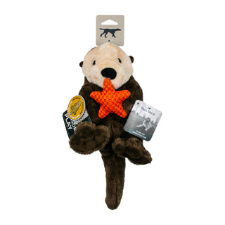 Plush otter toy with a starfish held in its mouth, on a white background