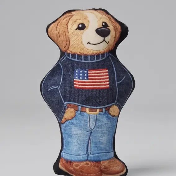 dog toy shaped like a dog wearing jeans and a blue sweater with an american flag on the front