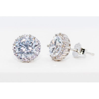 Pair of silver stud earrings with clear gemstones on a white background
