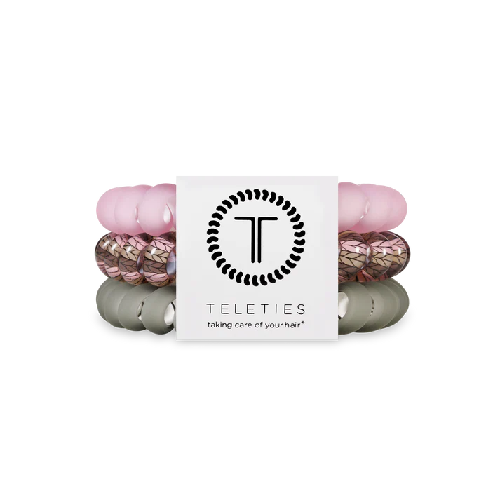 Set of pink and gray hair ties with 'Teleties' branding on a white background
