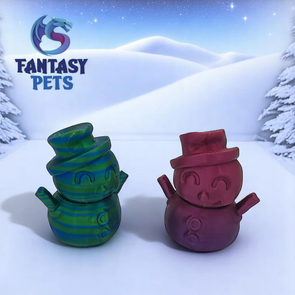 Two colorful snowman-shaped toys on a snowy background with 'Fantasy Pets' logo.