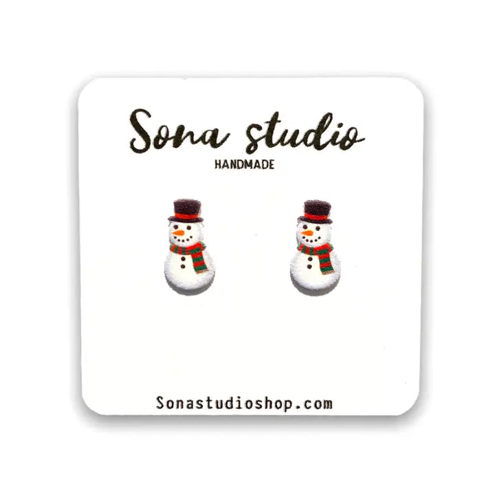 Snowman earrings on a branded card with 'Sona Studio' branding.