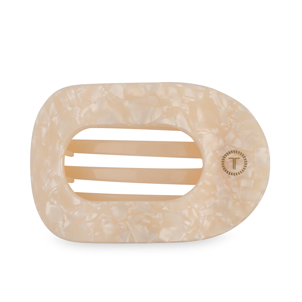 Beige marble-patterned hair clip on a white background