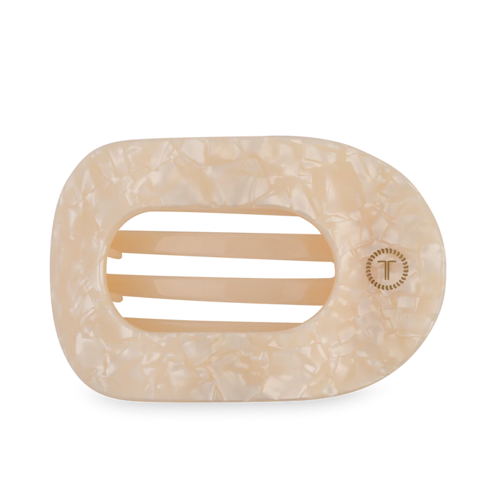 Beige marble-patterned hair clip on a white background