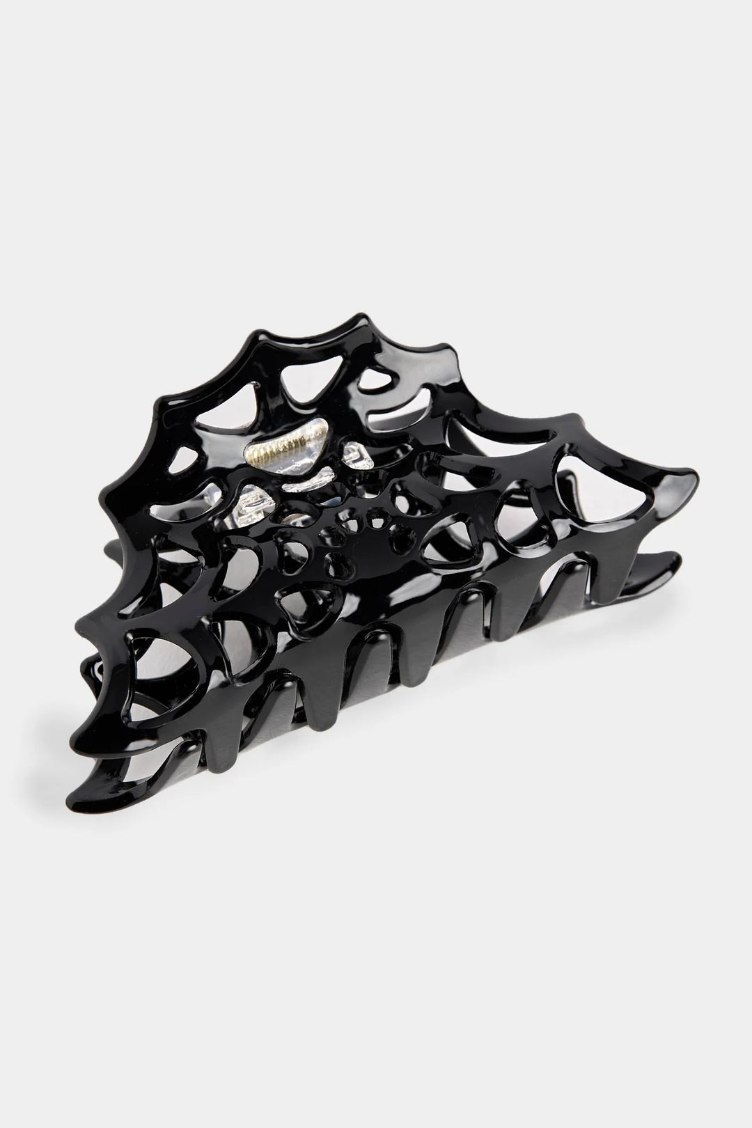 black claw clip shaped like a spiderweb