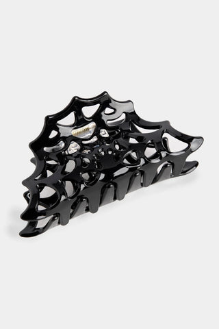 black claw clip shaped like a spiderweb