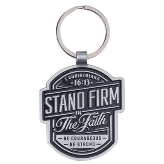Keychain with motivational quote 'Stand Firm in The Faith' on a white background