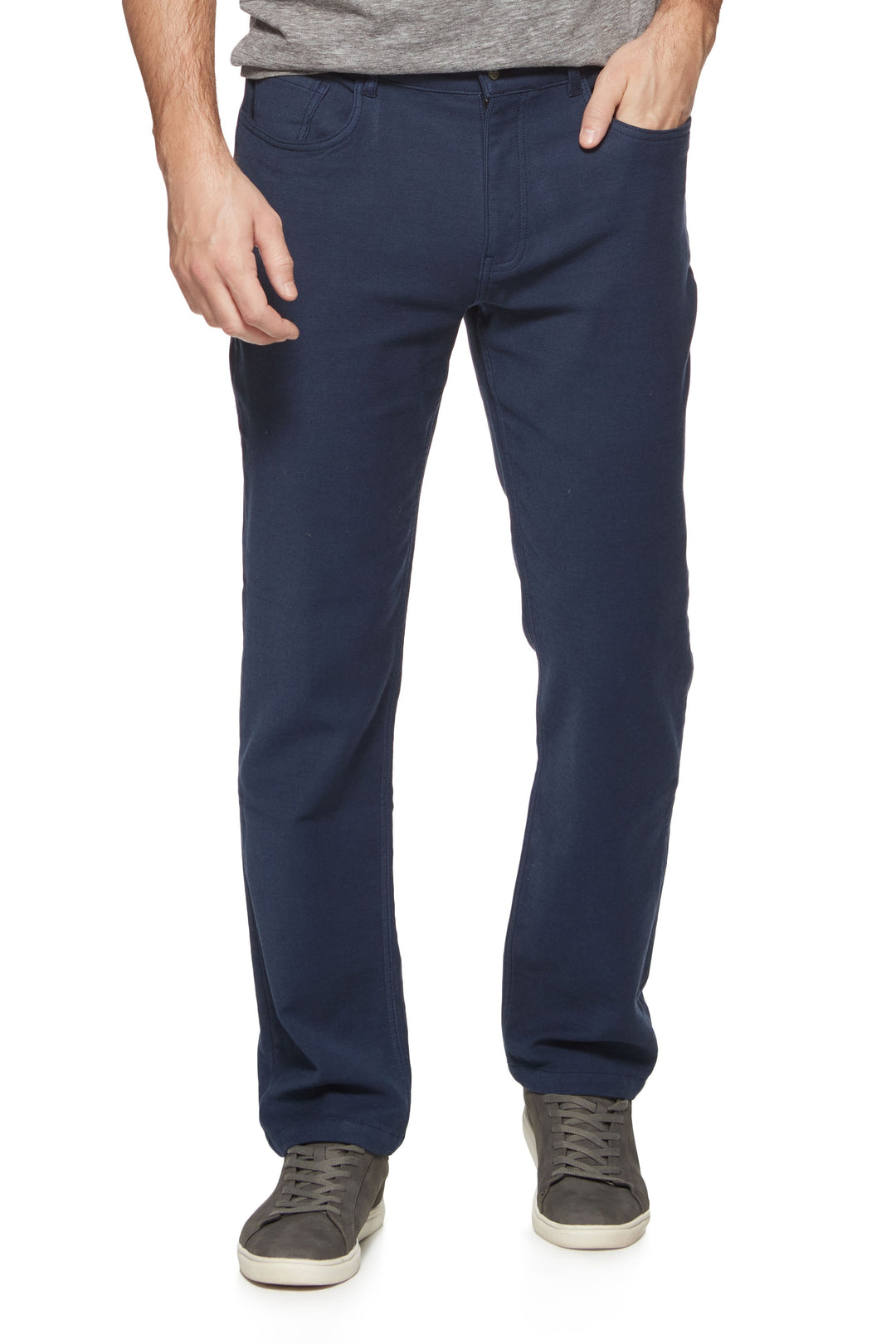 Person wearing navy blue pants on a white background