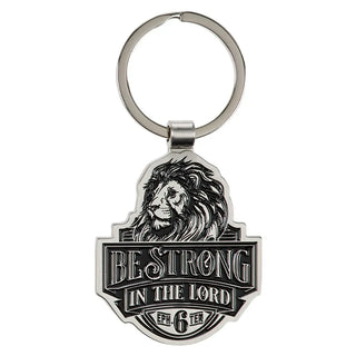 Keychain with lion design and 'Be Strong in the Lord' text on a white background