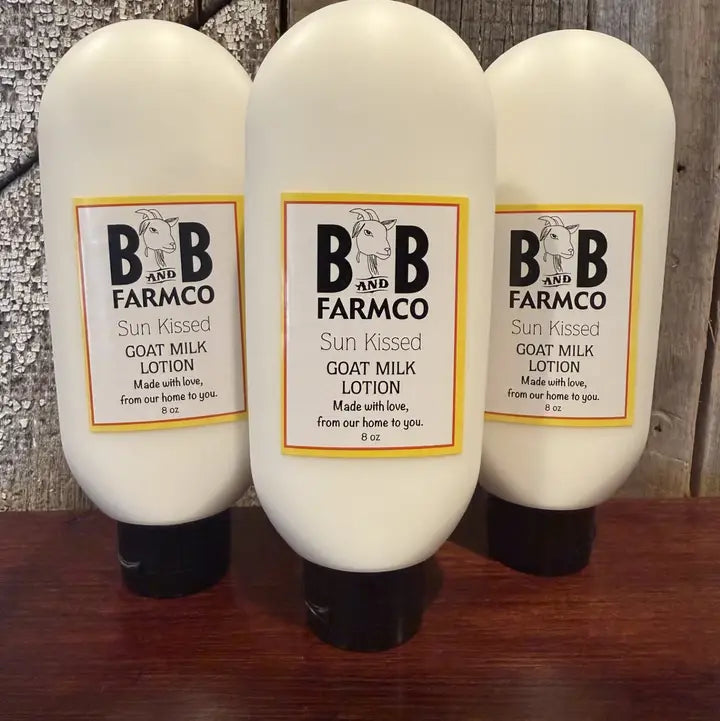 three bottles of sun kissed lotion on a rustic background